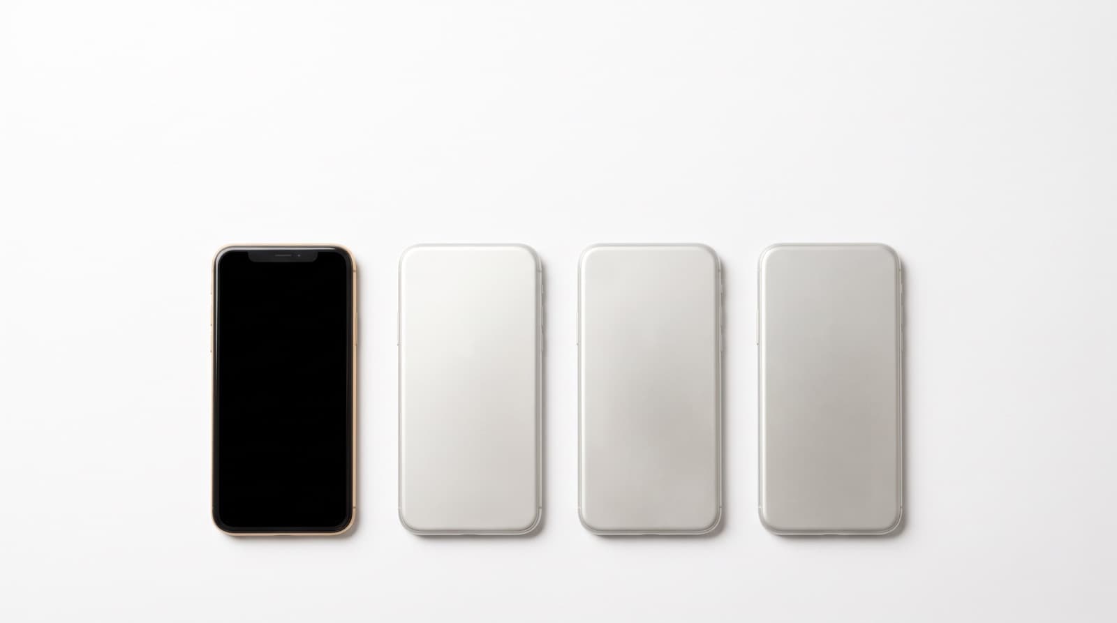 Four identical phones in a row, three face-down and one face-up