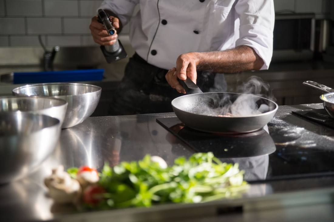 A cook working the pass